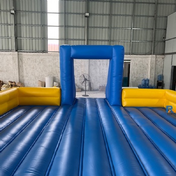 blue-and-yellow inflatable soccer field