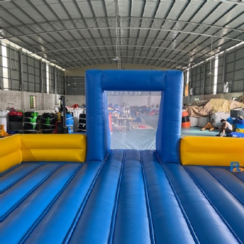 blue-and-yellow inflatable soccer field