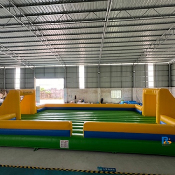 green-and-yellow inflatable soccer field