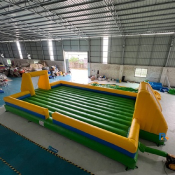 green-and-yellow inflatable soccer field