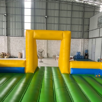 green-and-yellow inflatable soccer field
