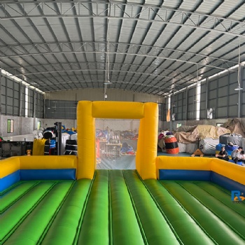 green-and-yellow inflatable soccer field